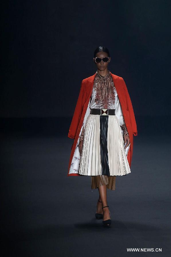 A model presents a creation of the winter collection of 'Victor Dzenk' 2015 during the 38th Sao Paulo Fashion Week (SPFW), in Sao Paulo, Brazil, on Nov. 3, 2014.