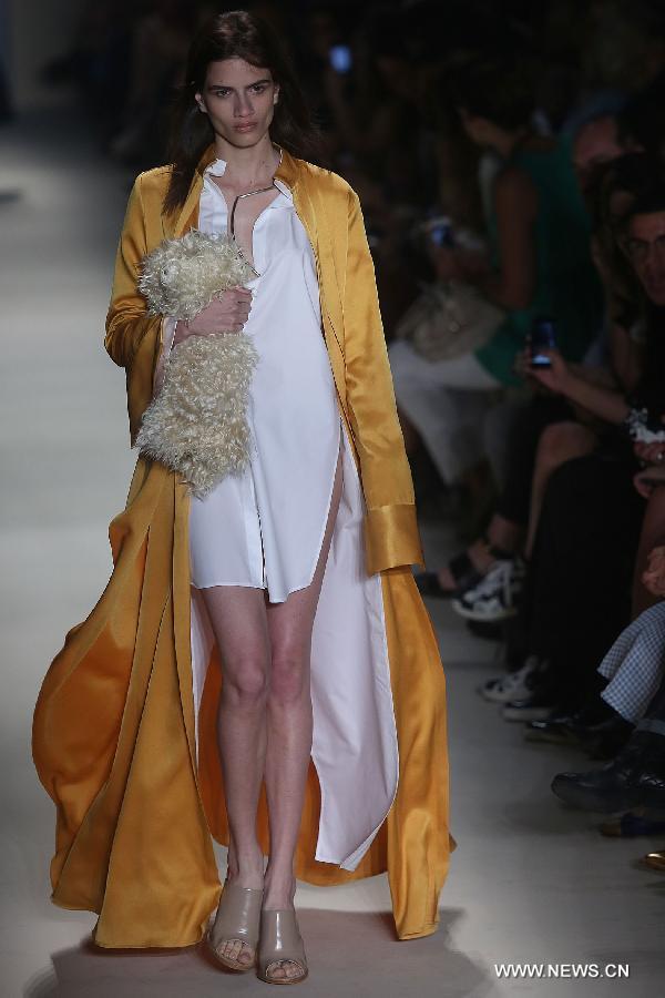 A model presents a creation of the winter collection Animale 2015 during the 38th Sao Paulo Fashion Week (SPFW), in Sao Paulo, Brazil, on Nov. 3, 2014. 
