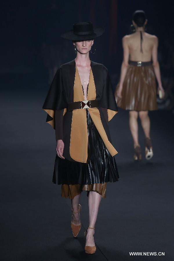 A model presents a creation of the winter collection of 'Victor Dzenk' 2015 during the 38th Sao Paulo Fashion Week (SPFW), in Sao Paulo, Brazil, on Nov. 3, 2014.