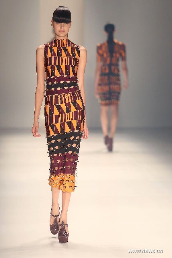 Models present creations of 'Lolitta' 2015 collection during 38th Sao Paulo Fashion Week (SPFW) held in Sao Paulo, Brazil, on Nov. 4, 2014.