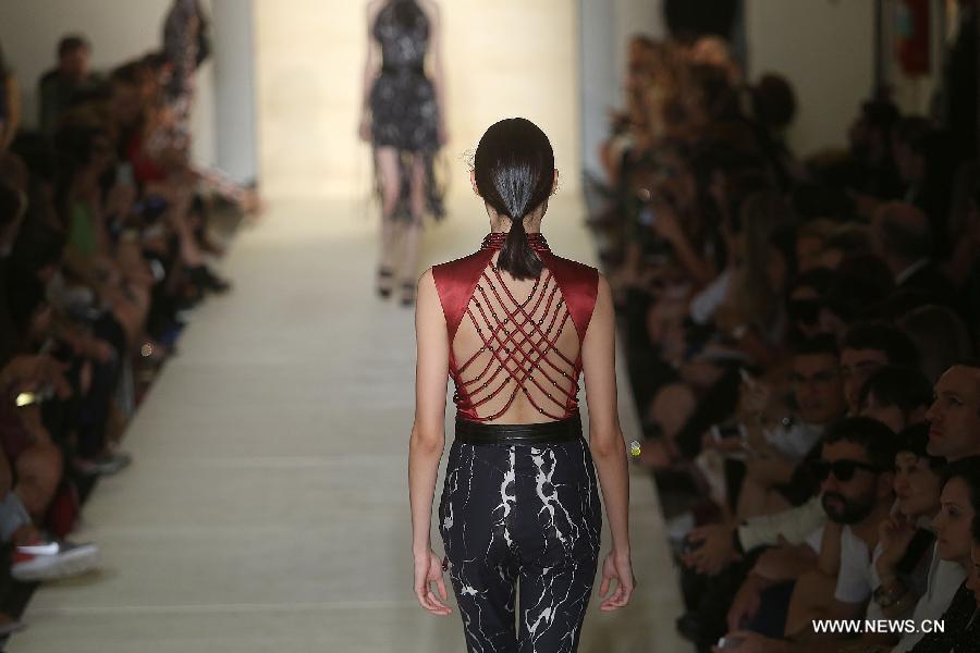 Models present creations of 'Lolitta' 2015 collection during 38th Sao Paulo Fashion Week (SPFW) held in Sao Paulo, Brazil, on Nov. 4, 2014.