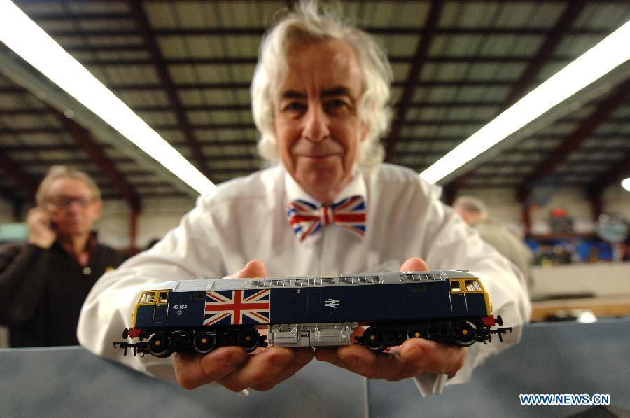 British Rail enthusiast Don Ogden shows a model train engine during the 32nd Model Railway Exhibition 'Trains 2014' in Burnaby, Canada, Nov. 8, 2014. 