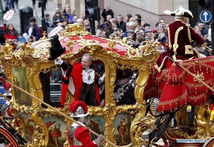 Alan Yarrow (C), the new Lord Mayor of London greets the crowd during the annual Lord Mayor's Show in London, Britain on Nov. 8, 2014. 