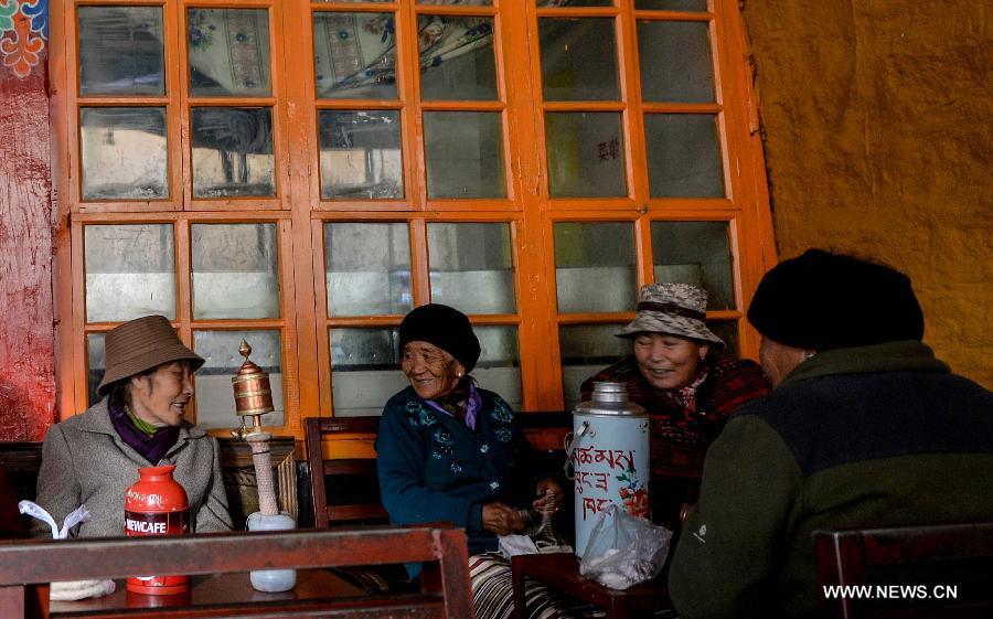 Customers drink sweet tea at a teahouse named Canggusi in Lhasa, capital of southwest China's Tibet Autonomous Region, Nov. 7, 2014