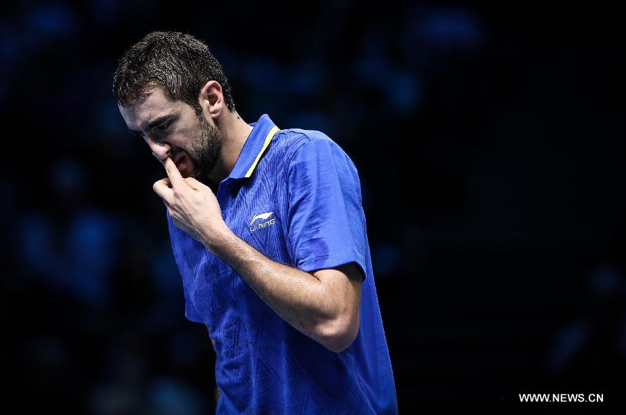 Marin Cilic of Croatia reacts during the ATP World Tour Finals Group match against Tomas Berdych of the Czech Republic in London, Britain, on Nov. 12, 2014.