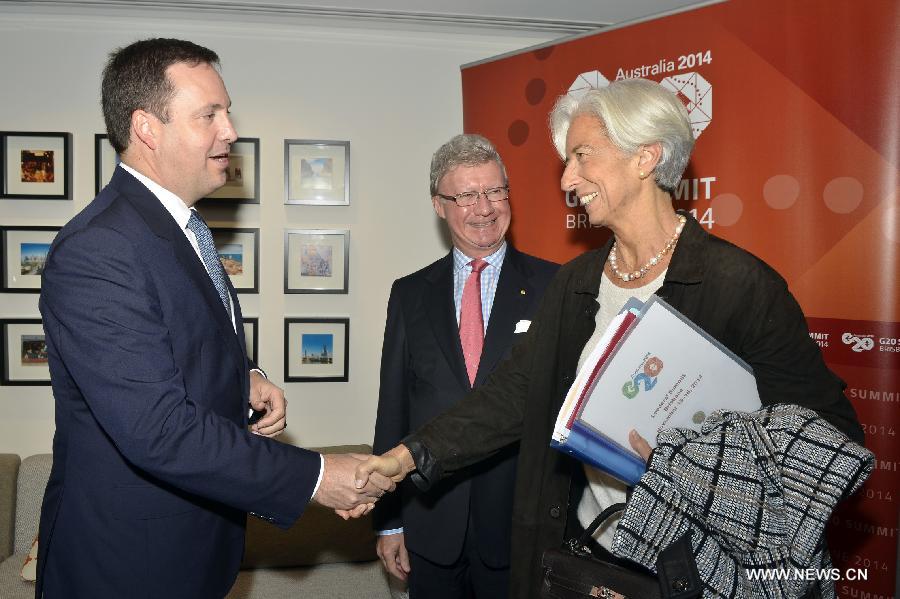 International Monetary Fund Managing Director Christine Lagarde (R) arrives at Brisbane Airport to attend the G20 Summit in Brisbane, Australia, on Nov. 13, 2014. 