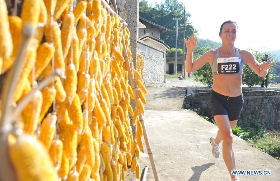 Kauri Mari of Finland competes during the 2014 Great Hakka Marathon in Nanjing County, southeast China's Fujian Province, on Nov. 15, 2014.
