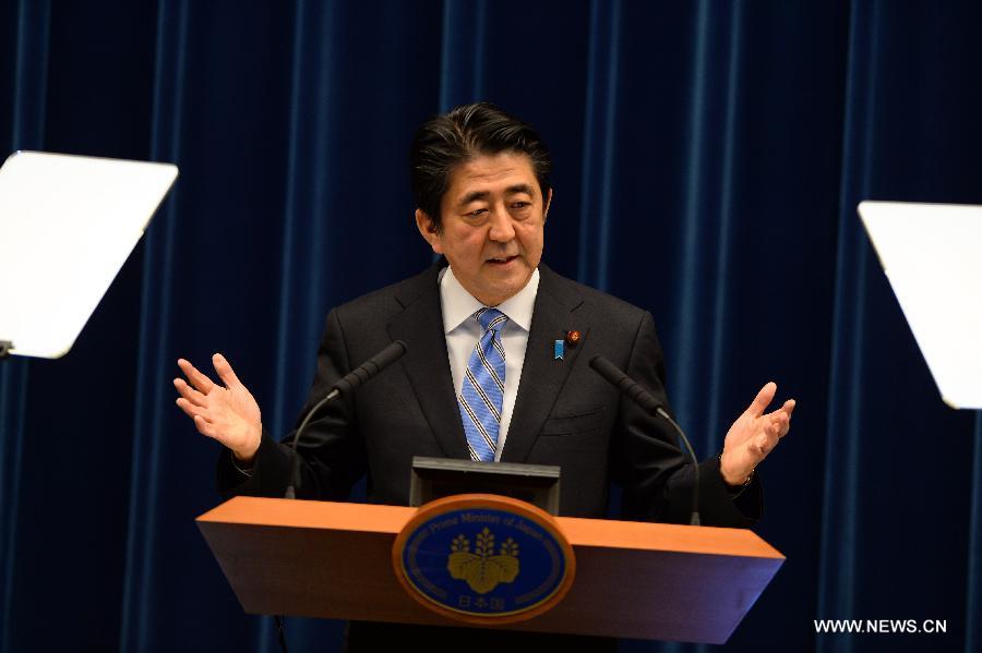 Japanese Prime Minister Shinzo Abe addresses a press conference in Tokyo, Japan, Nov. 18, 2014.