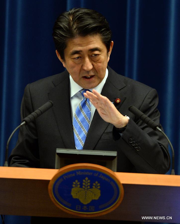 Japanese Prime Minister Shinzo Abe addresses a press conference in Tokyo, Japan, Nov. 18, 2014. 