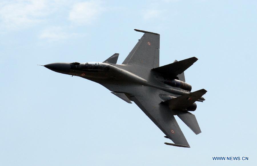 An Indian Air Force (IAF) Sukhoi Su-30 fighter aircraft flies during a parade at an airbase in Tezpur, India, on Nov. 21, 2014.