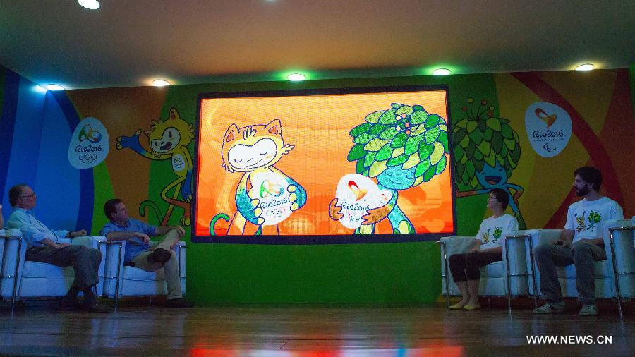 Representatives watch a video clip about the mascots of Rio 2016 Olympic and Paralympic Games in Rio de Janeiro, Brazil, Nov. 24, 2014. 