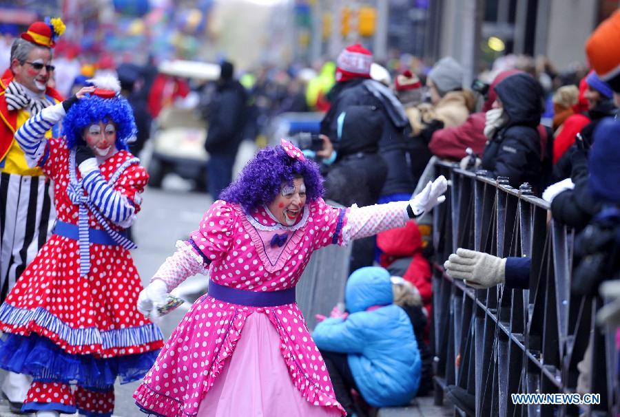 People attend the 88th Macy's Thanksgiving Day Parade in New York, the United States, Nov. 27, 2014.