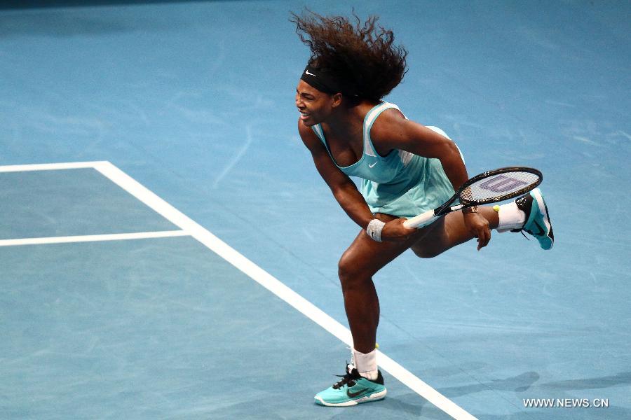 DBS Singapore Slammers player Serena Williams of the United States returns the ball against Manila Mavericks player Kirsten Flipkens of Belgium during the women's singles match in the International Premier Tennis League in Pasay City, the Philippines, on Nov. 30. 2014. 