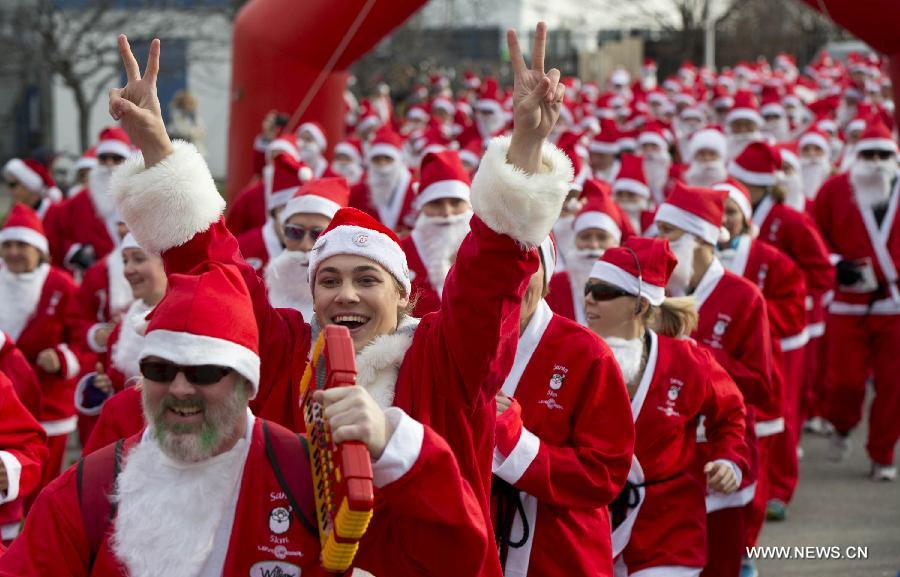 Participants dressed as Santa Claus take part in the 2014 Santa Race in Hamilton, Ontario, Canada, Nov. 30, 2014. 