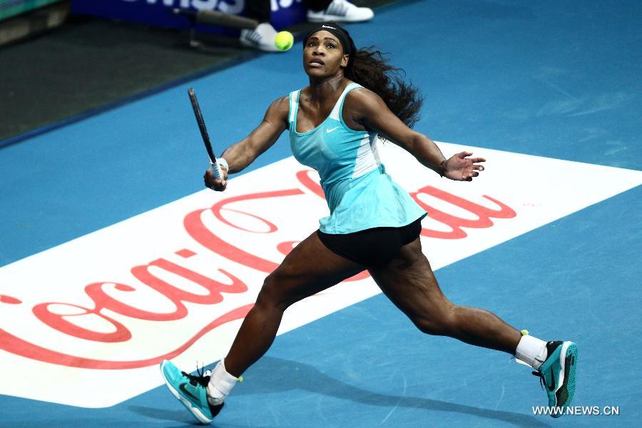 DBS Singapore Slammers player Serena Williams of the United States returns the ball against Manila Mavericks player Kirsten Flipkens of Belgium during the women's singles match in the International Premier Tennis League in Pasay City, the Philippines, on Nov. 30. 2014. 