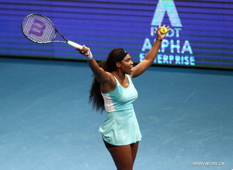 DBS Singapore Slammers player Serena Williams of the United States celebrates after the women's singles match against Manila Mavericks player Kirsten Flipkens of Belgium in the International Premier Tennis League in Pasay City, the Philippines, on Nov. 30. 2014. 