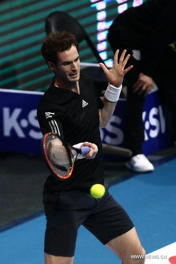 Manila Mavericks player Andy Murray of Britain returns the ball against DBS Singapore Slammers player Nick Kyrgios of Australia during the men's singles match in the International Premier Tennis League in Pasay City, the Philippines, on Nov. 30. 2014. 
