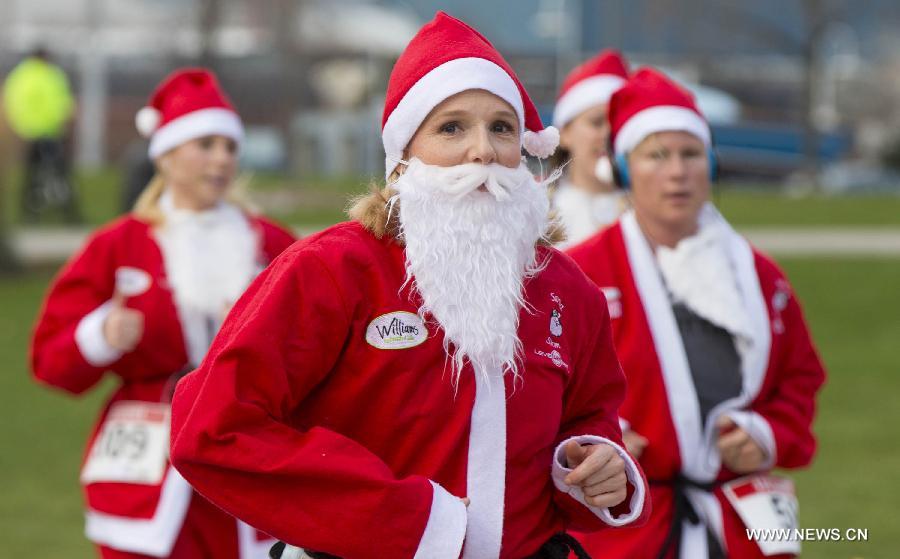 Participants dressed as Santa Claus take part in the 2014 Santa Race in Hamilton, Ontario, Canada, Nov. 30, 2014. 