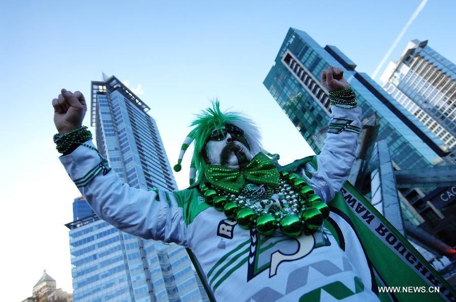 A football fan poses during CFL's 102nd Grey Cup finals in Vancouver, Canada, Nov. 30, 2014. Calgary Stampeders defeated Hamilton Tiger-Cats and captured 102nd Grey Cup.