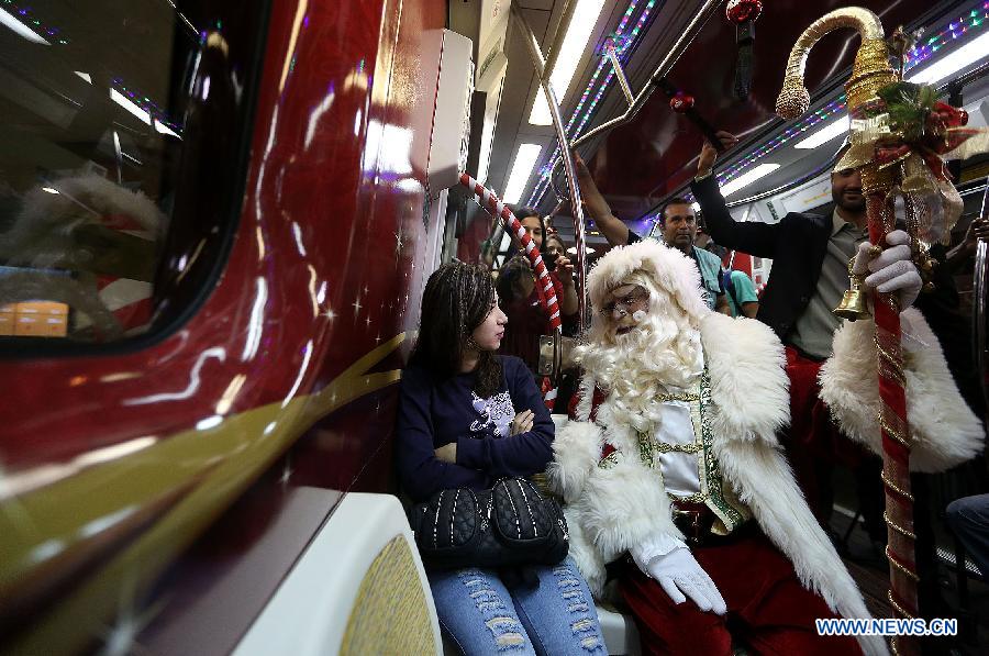 An actor disguised as Santa Claus travels in a wagon of the Sao Paulo Metro Yellow Line, in the city of Sao Paulo, Brazil, on Dec. 1, 2014.