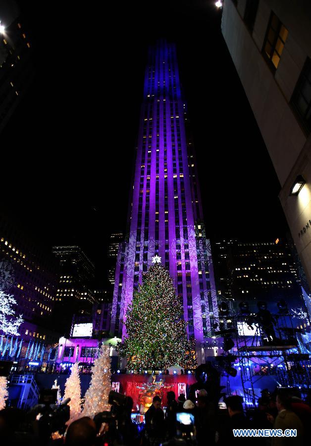 Photo taken on Dec. 3, 2014 shows the Christmas tree with all the lights lit up during the 82nd Christmas Tree Lighting Ceremony in Rockefeller Center in New York, the United States. 