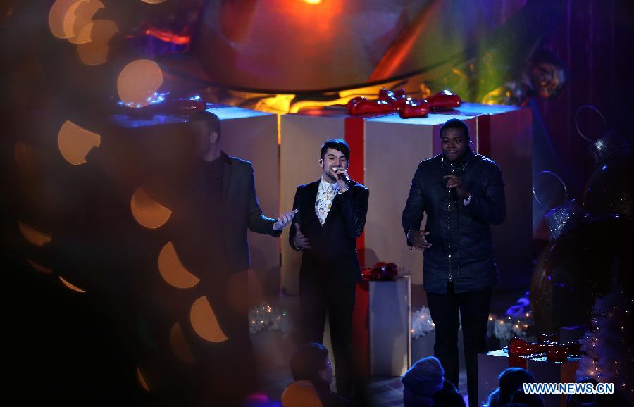 Members of the American band Pentatonix perform during the 82nd Christmas Tree Lighting Ceremony in Rockefeller Center in New York, the United States, Dec. 3, 2014.