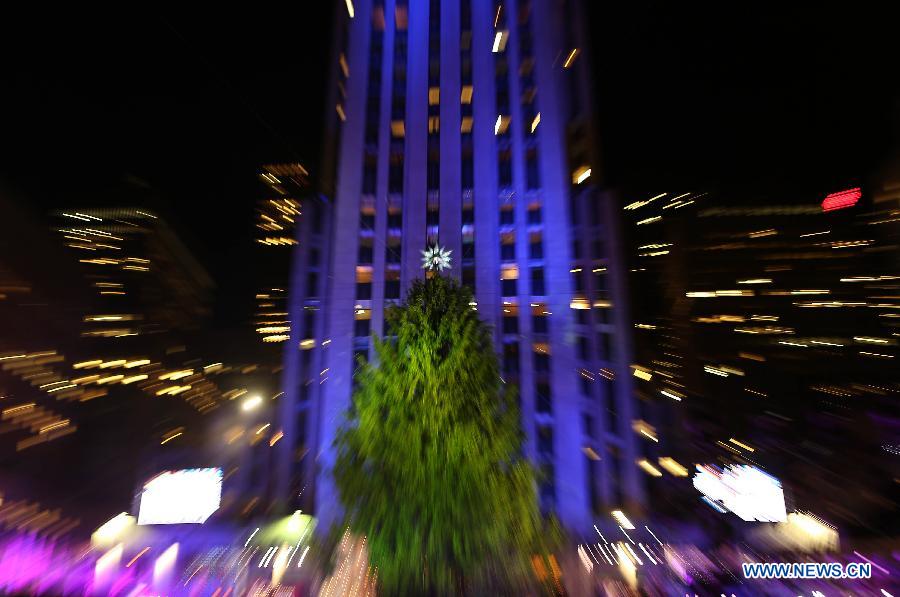 Photo taken on Dec. 3, 2014 shows the Norway Spruce during the 82nd Christmas Tree Lighting Ceremony in Rockefeller Center in New York, the United States.