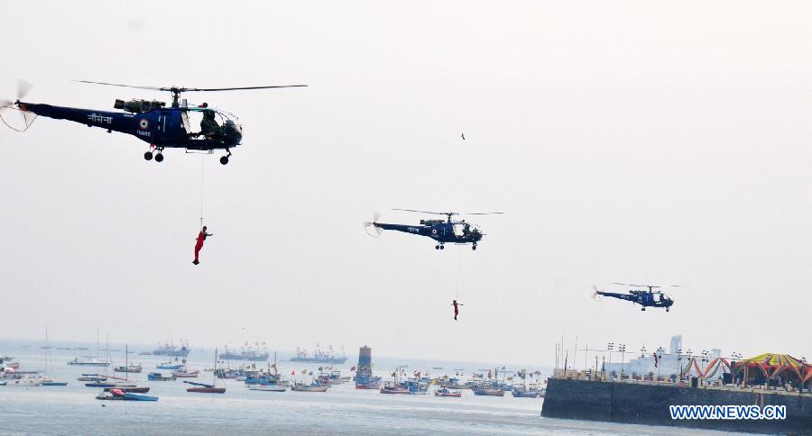 Indian Navy soldiers perform on the Navy Day celebration in Mumbai, India, Dec. 4, 2014. 