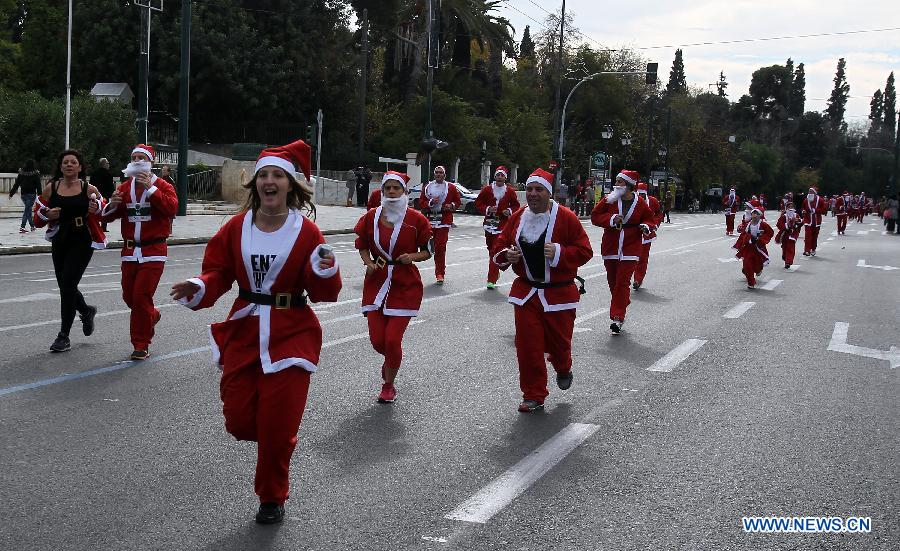 Runners wearing Santa Claus suits attend the first 'Santa Run' race in Athens, capital of Greece, Dec. 7, 2014.