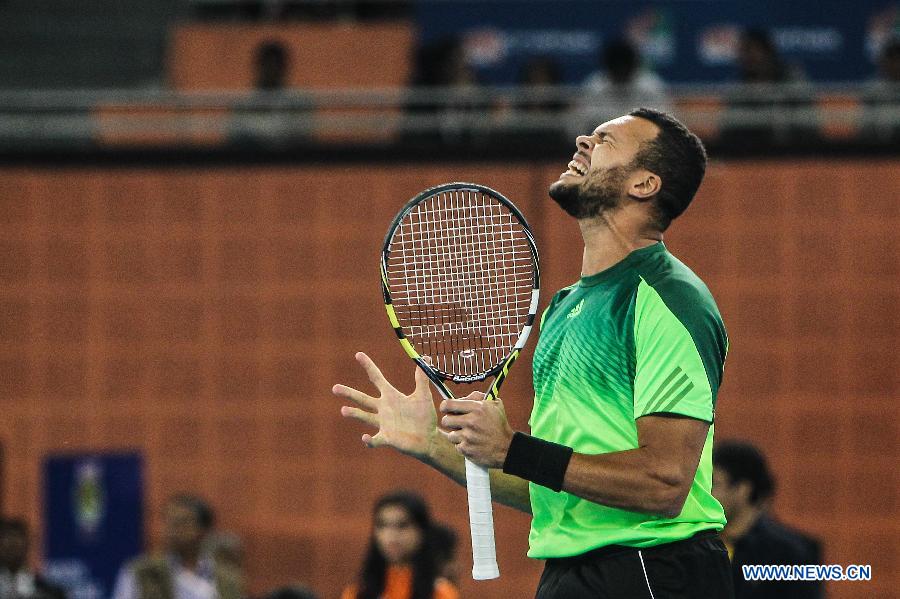 Jo-Wilfried Tsonga of Manila Mavericks reacts during the match against Nick Kyrgios of Singapore Slammers at the Indian Leg of the International Premier Tennis League in New Delhi, India, Dec. 8, 2014. Manila Mavericks won 23-17. (Xinhua/Zheng Huansong) 