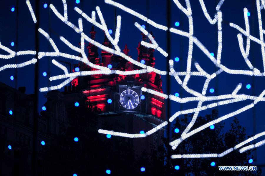 The cityhall is illuminated with lights for Christmas in Madrid, Spain on Dec. 11, 2014.