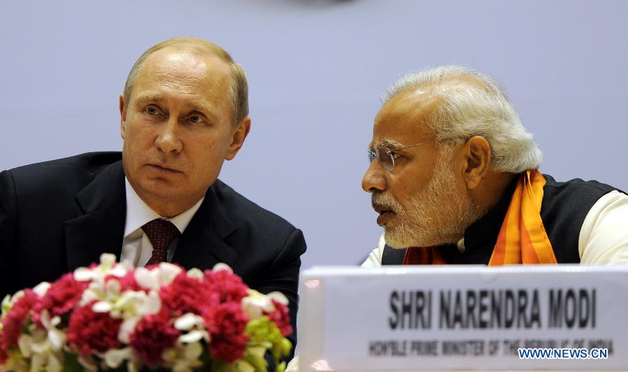 Indian Prime Minister Narendra Modi (R) and Russian President Vladimir Putin attend the World Diamond Conference in New Delhi Dec. 11, 2014.