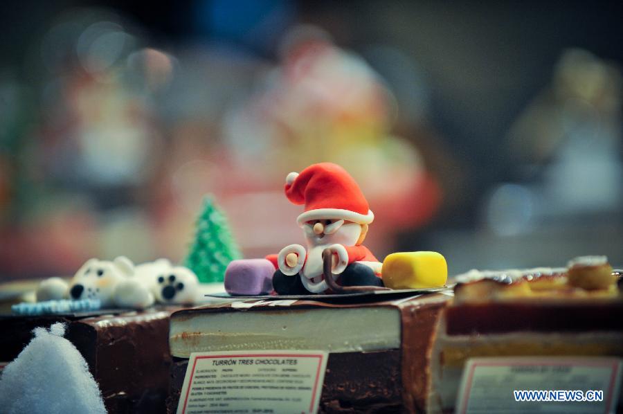 A Christmas decoration is seen in a shop window in Madrid, Spain on Dec. 11, 2014.