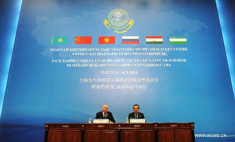 Kazakh Prime Minister Karim Masimov (R) and Secretary-General of the Shanghai Cooperation Organization (SCO) Dmitry Mezentsev attend a press conference in Astana, Kazakhstan, Dec. 15, 2014.
