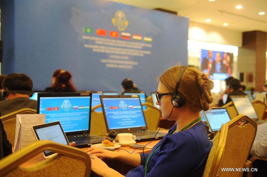 Journalists work at the press center in Astana, Kazakhstan, Dec. 15, 2014.