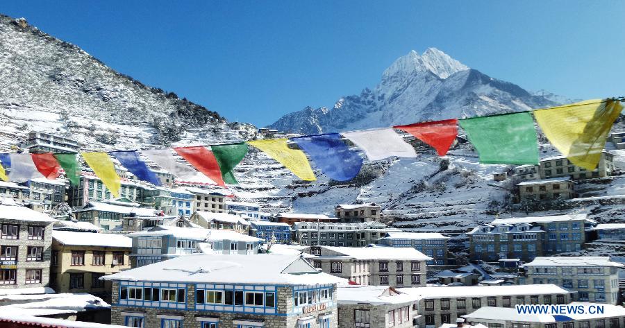 Photo taken on Dec. 16, 2014 shows the view of Namche Bazar after the snowfall in Solukhumbu, Nepal.