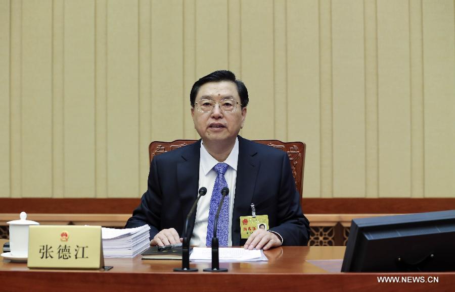 Zhang Dejiang, chairman of the Standing Committee of the National People's Congress (NPC), presides over the 12th meeting of the 12th NPC Standing Committee in Beijing, capital of China, Dec. 22, 2014.