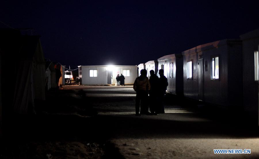 Newly arrived Syrian refugees are seen near Royashed Town, Jordan, Dec. 25, 2014. Syrian refugees continued to cross into Jordan.(