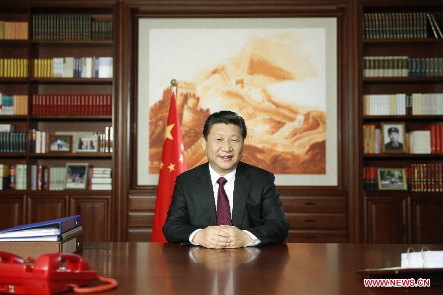 Chinese President Xi Jinping delivers his New Year speech via state broadcasters, in Beijing, capital of China, Dec. 31, 2014. (Xinhua/Ju Peng)