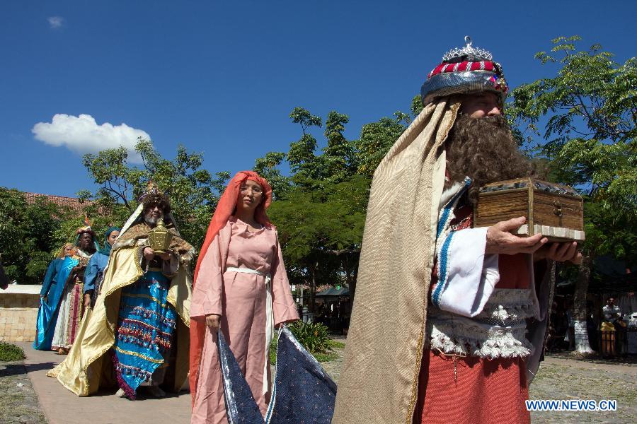People characterized as the Three Wise Men, namely Melchior, Caspar and Balthazar, walk on a street for the celebration of Jan. 6, the Day of the Three Wise Men, in Suchitoto city, El Salvador, on Jan 4, 2015.