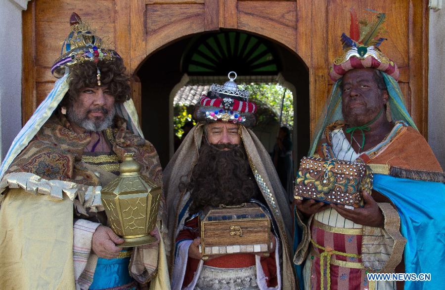 People characterized as the Three Wise Men, namely Melchior, Caspar and Balthazar, pose before a pilgrimage on the streets, for the celebration of Jan. 6, the Day of the Three Wise Men, in Suchitoto city, El Salvador, on Jan 4, 2015.