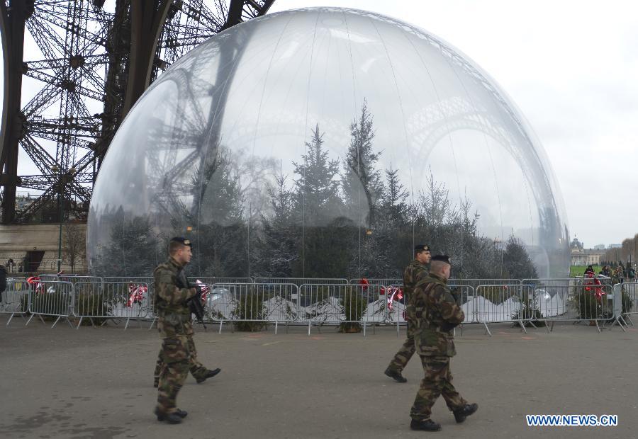Police walk into a metro station in Paris, France, Jan. 8, 2015. Paris is beefing up security in precaution after Wednesday's deadly terrorist which left 12 people killed and 11 others injured.
