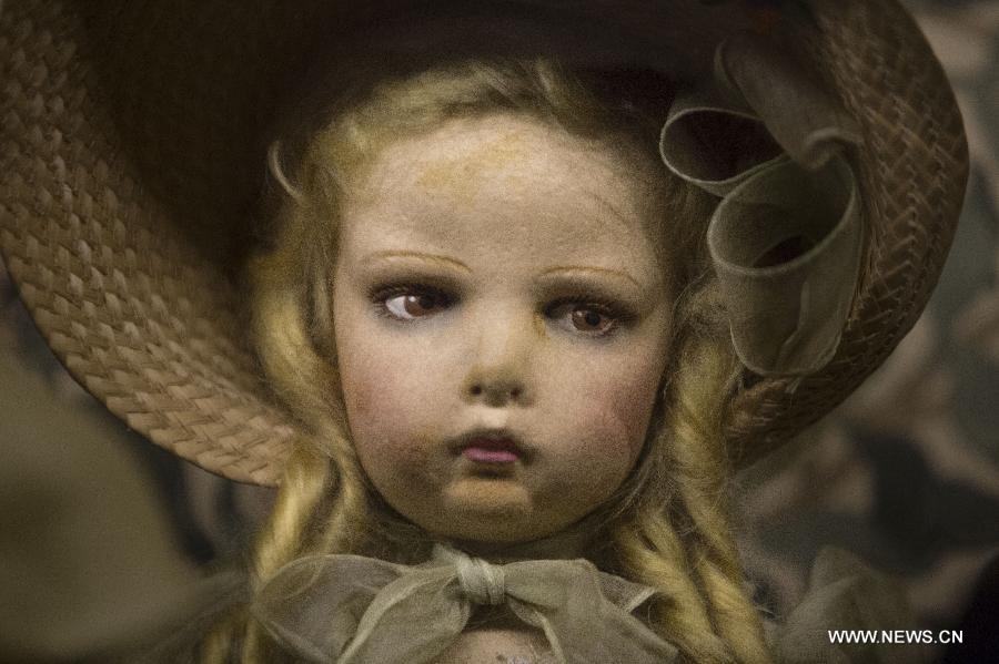 An ancient doll is shown during the exhibit 'Once upon a time... Dolls and Toys (1870-1940)', in the Hispanic American Art Museum 'Isaac Fernandez Blanco', in Buenos Aires, Argentina, on Jan. 9, 2015.