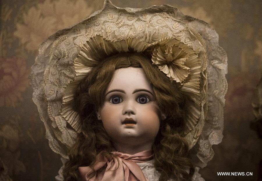 An ancient doll is shown during the exhibit 'Once upon a time... Dolls and Toys (1870-1940)', in the Hispanic American Art Museum 'Isaac Fernandez Blanco', in Buenos Aires city, Argentina, on Jan. 9, 2015.