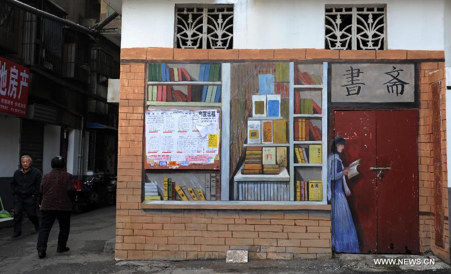 A notice board is mixed into the cartoon mural of a traditional Chinese study in a residential community of Changsha, capital of central China's Hunan Province, Jan. 15, 2015. The exterior walls of a residential community in Changsha have been rejuvenated, after a group of young cartoonists were invited to create some 40 cartoon murals on them. The mural painters not only drew on plain walls, but also blended their work with the environment by integrating objects on the scene (newspaper boxes, electricity meter cases, air-conditioning units, etc.) into the murals. (Xinhua/Li Ga)