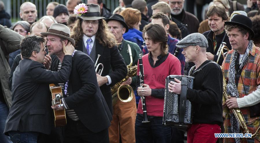 People attend the funeral of slain Charlie Hebdo editor-in-chief Stephane Charbonnier (who publishes under the pen name Charb) in Pontoise, outside Paris, Jan. 16, 2015.