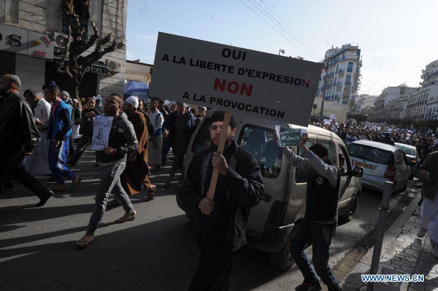 Algerian people protest against sarcastic cartoons on the Prophet of Islam Muhammad, which have been published in the latest edition of French weekly Charlie Hebdo, in the capital city of Algiers, Algeria, Jan. 16, 2015.