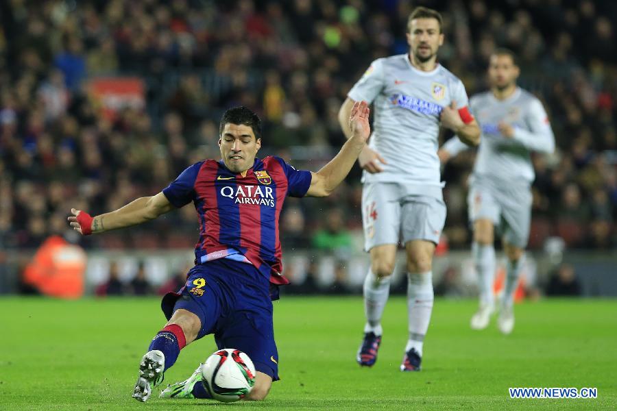 Barcelona's Uruguayan forward Luis Suarez competes during the King's Cup quarter-final first leg soccer match against Atletico Madrid at the Nou Camp stadium in Barcelona Jan. 21, 2015. 