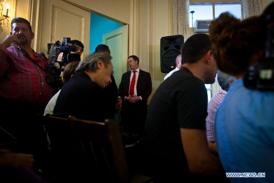 Journalists attend a press conference located at the residence of the Chief of Mission of the United States Interest Section in Havana, Cuba, Jan. 23, 2015.