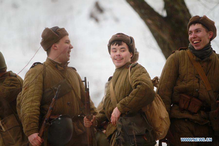 Reenactors dressed as World War II (WWII) Soviet Red Army troops take part in a battle reconstruction marking the 72nd anniversary of the breakthrough of Leningrad (St. Petersburg) from the Nazi blockade in WWII on Jan. 18, 2015, in St. Petersburg, Russia.